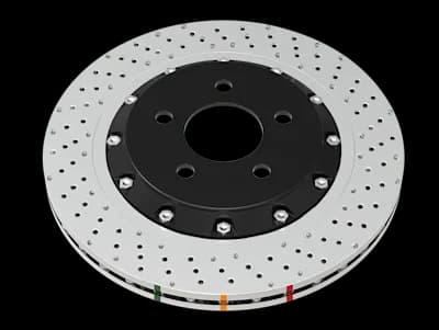 DBA 5000 Series XD Bremsscheibe mit nicht-direktionalen Querbohrungen und Mulden auf silberner Oberfläche mit schwarzer Mittelnabe und farbigen Indikatoren